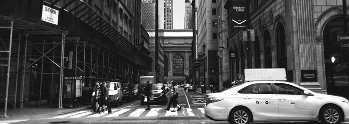 photo of a city street and passing vehicle